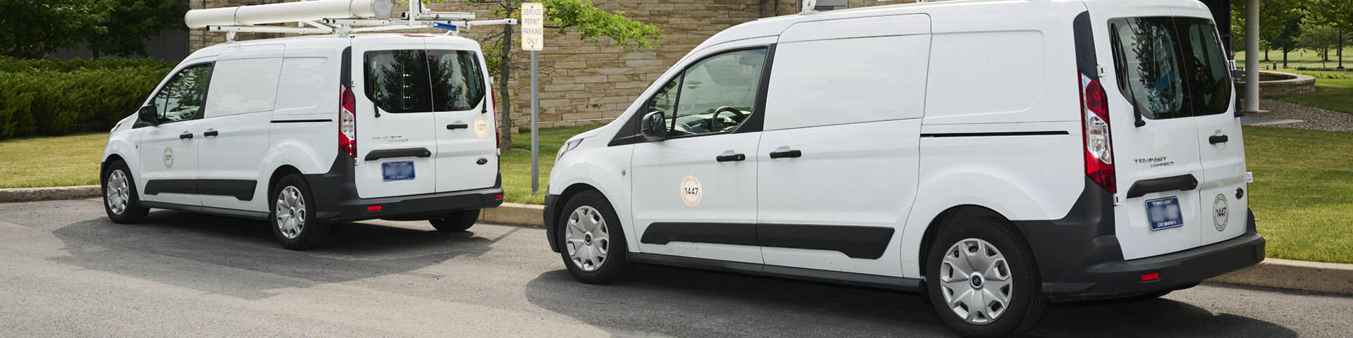 Vans parked in service spaces