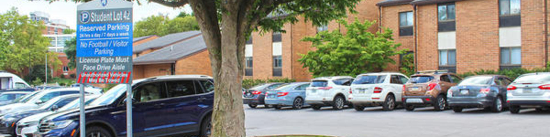 Student parking lot by Nittany Apartments