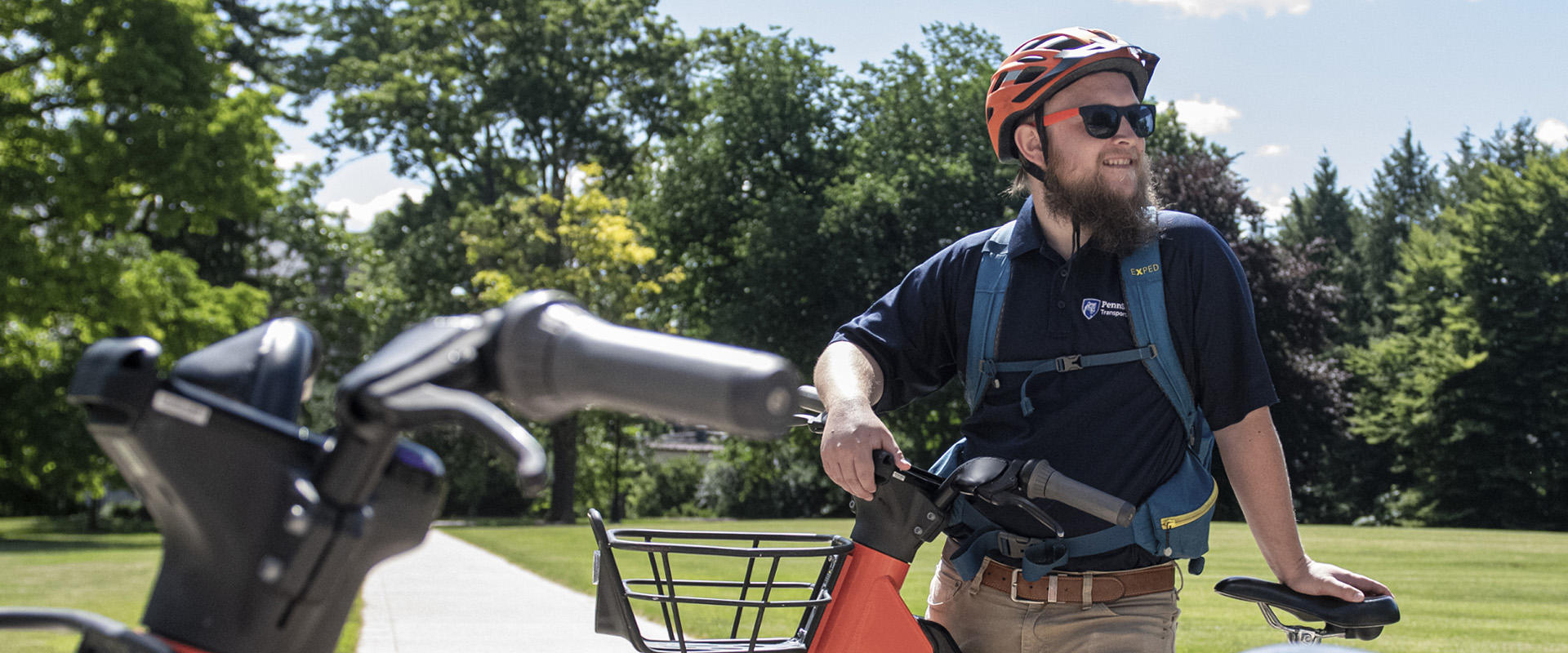 Cyclist standing with a electric assist bike